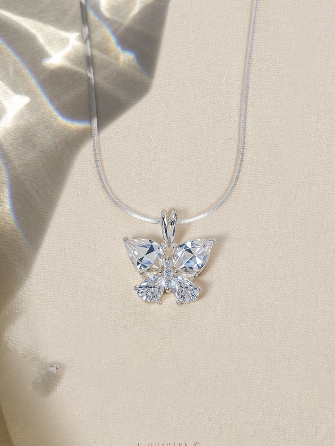 

HighSpark 92.5 Sterling Silver Cubic Zirconia Studded Butterfly Solitaire Pendant
