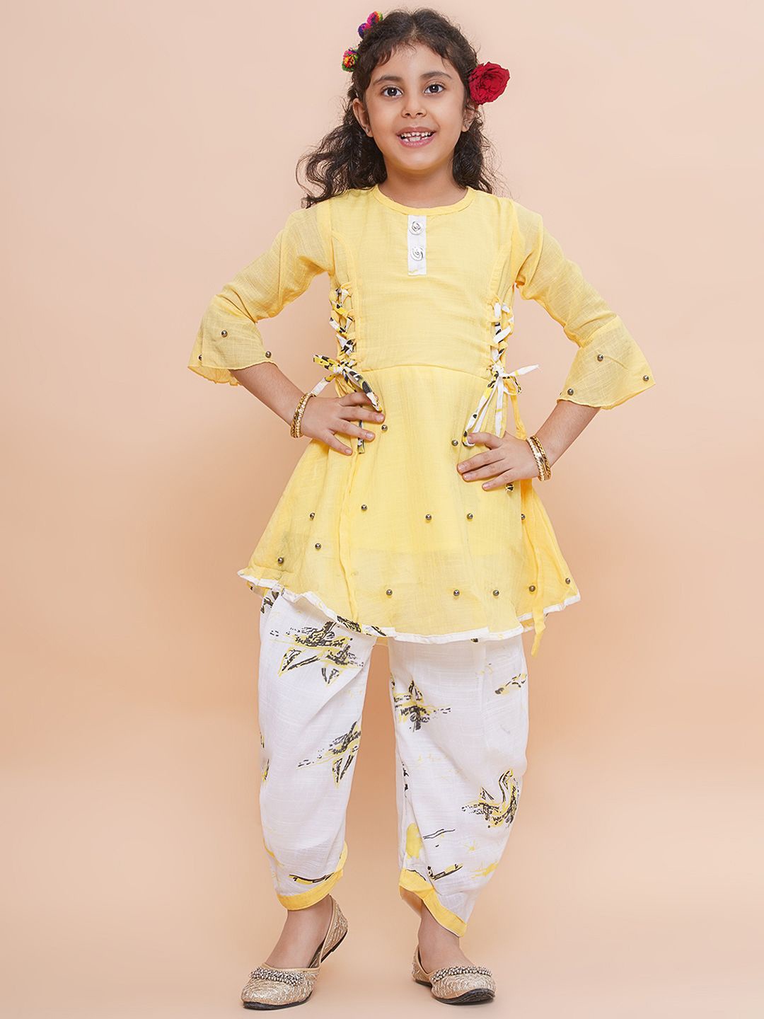 

Arshia Fashions Girls Floral Printed Regular Beads and Stones Kurti with Dhoti Pants, Yellow