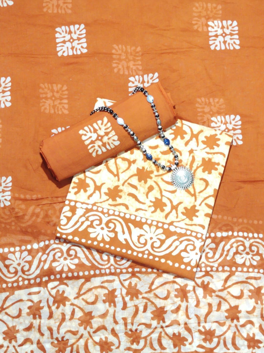 

Farooq Dyeing Printed Pure Cotton Unstitched Dress Material, Rust