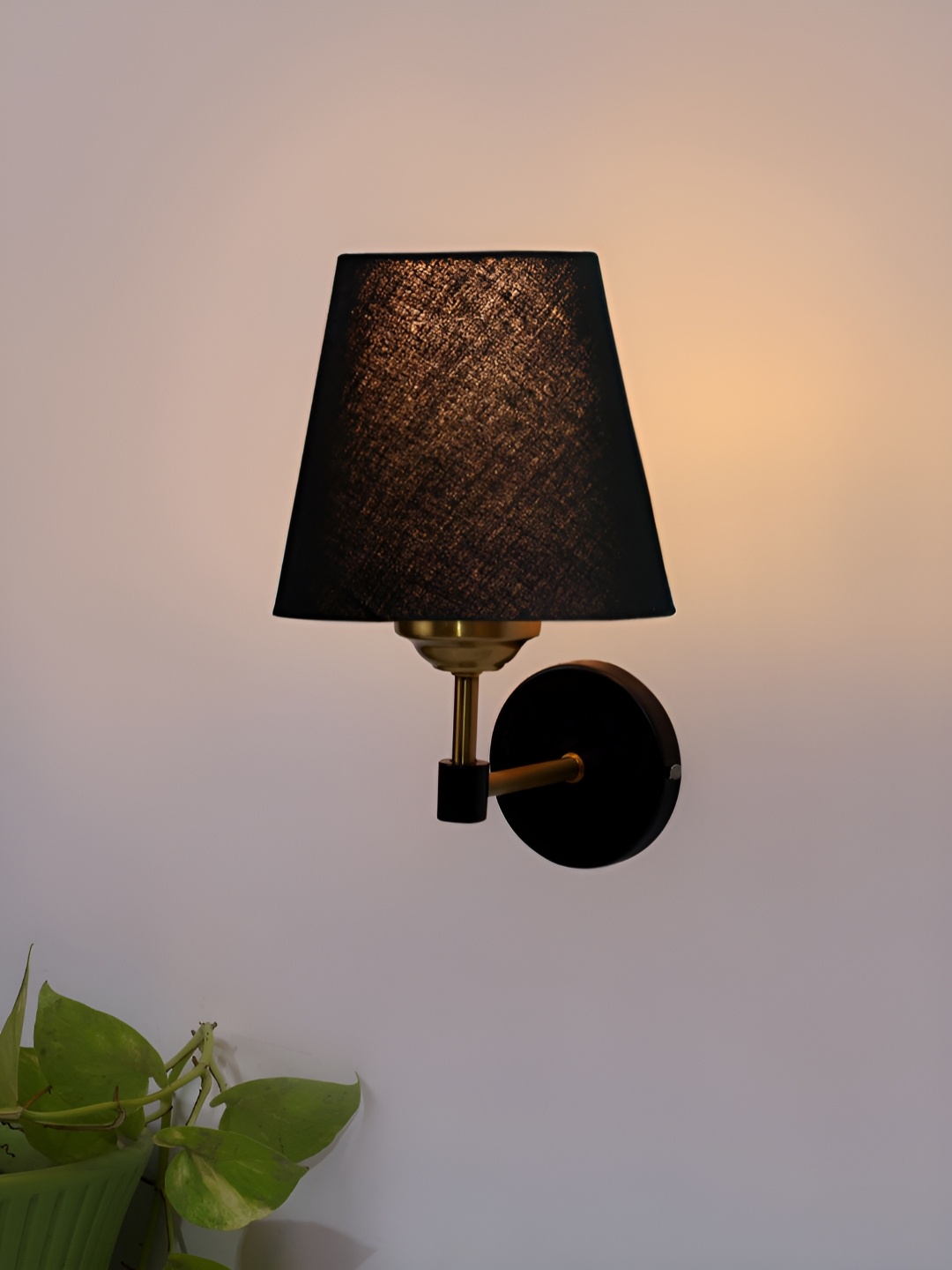 

Devansh Black & Gold-Toned Metal Traditional Frustum Shaped Wall Lamp