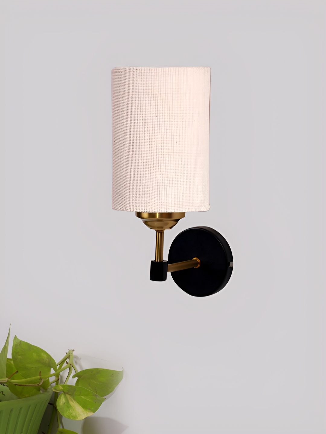 

Devansh White Metal Traditional Cylinder Shaped Wall Lamp