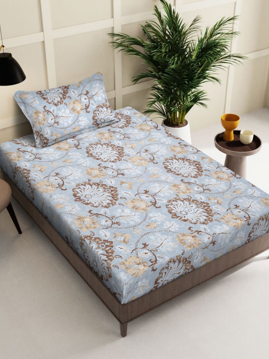 

Myntra Elegant Homes Blue & Brown Printed 300 TC Single Bedsheet Set 2.25 m x 1.50 m
