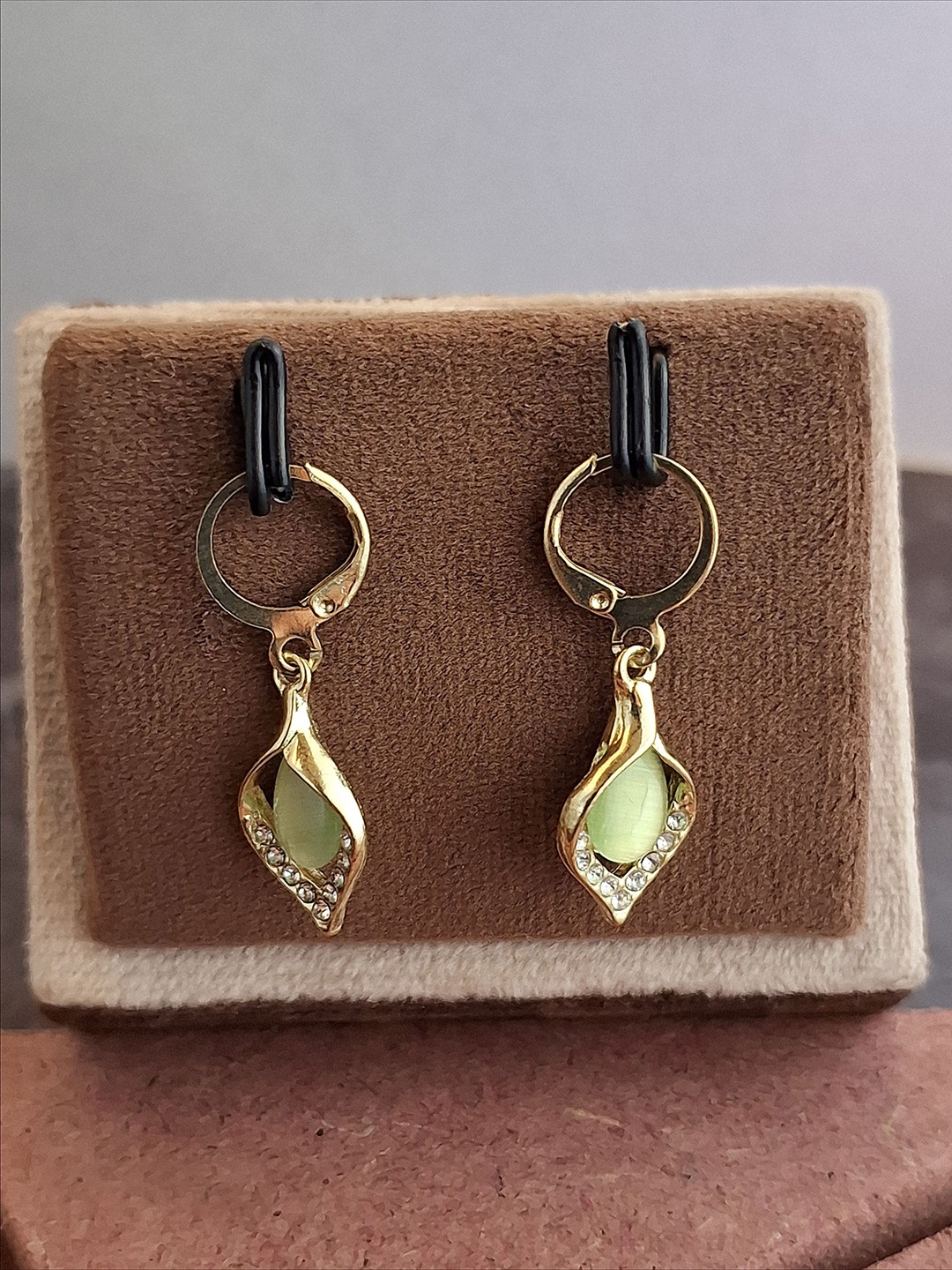 

Zhouse Gold-Plated Crystals Studded Leaf Shaped Drop Earrings