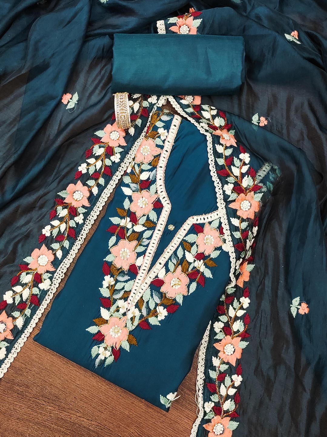 

SHADOW & SAINING Floral Embroidered Roman Silk Semi-Stitched Dress Material, Teal