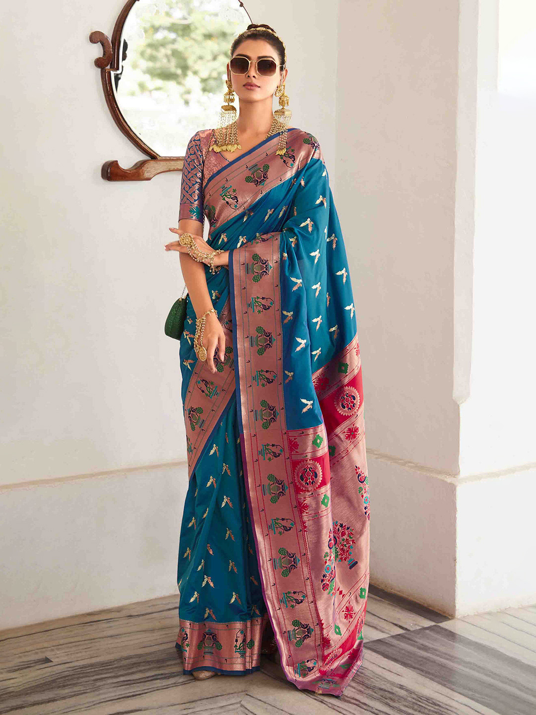 

Mitera Woven Design Zari Georgette Saree With Unstitched Blouse Piece, Blue
