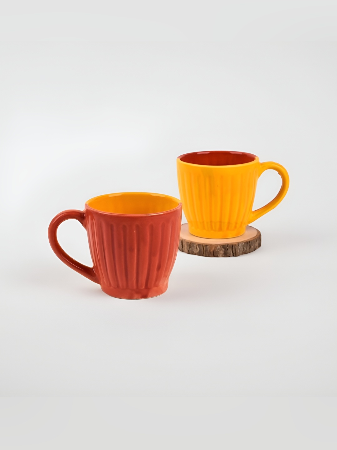 

Storepedia Orange & Yellow 2 Piece Textured Ceramic Matte Cups Set of Cups and Mugs