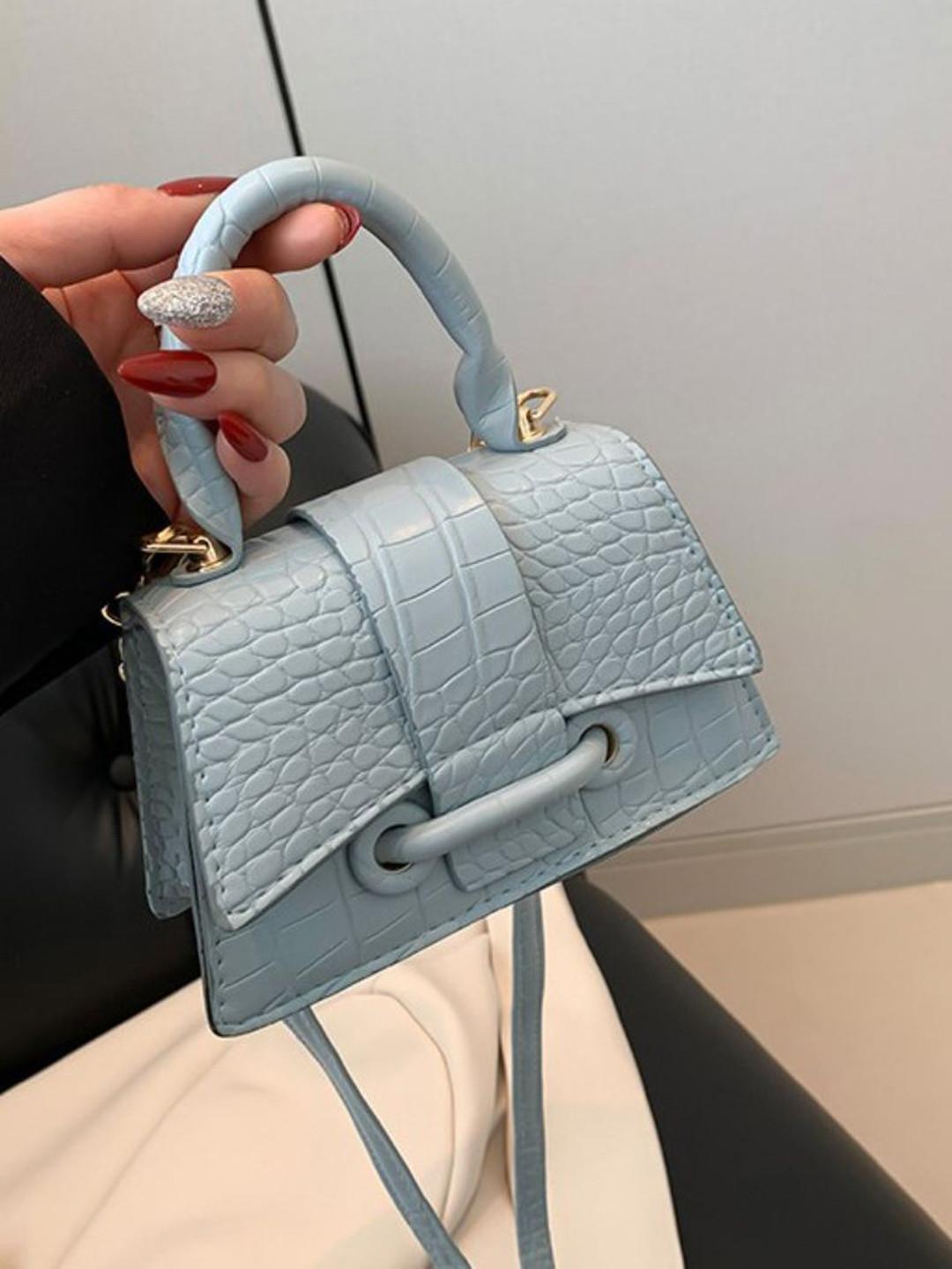 

DressBerry Women Textured Handheld Bag, Blue