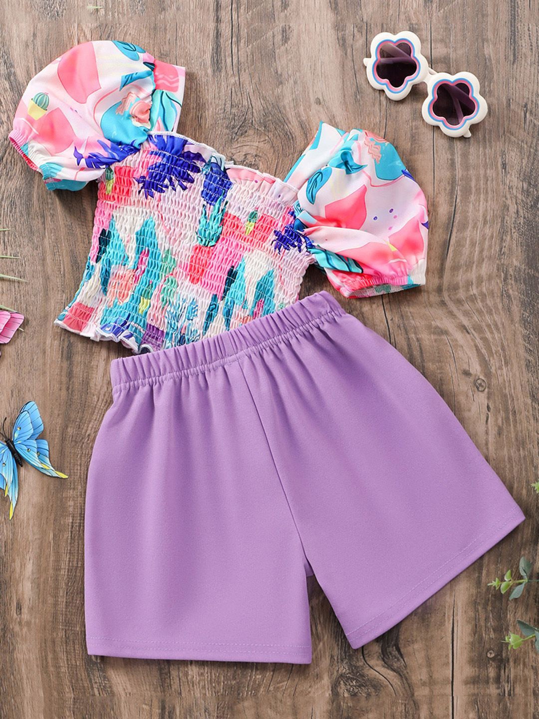 

INCLUD Girls Short Sleeve Smocked Top With Purple Shorts