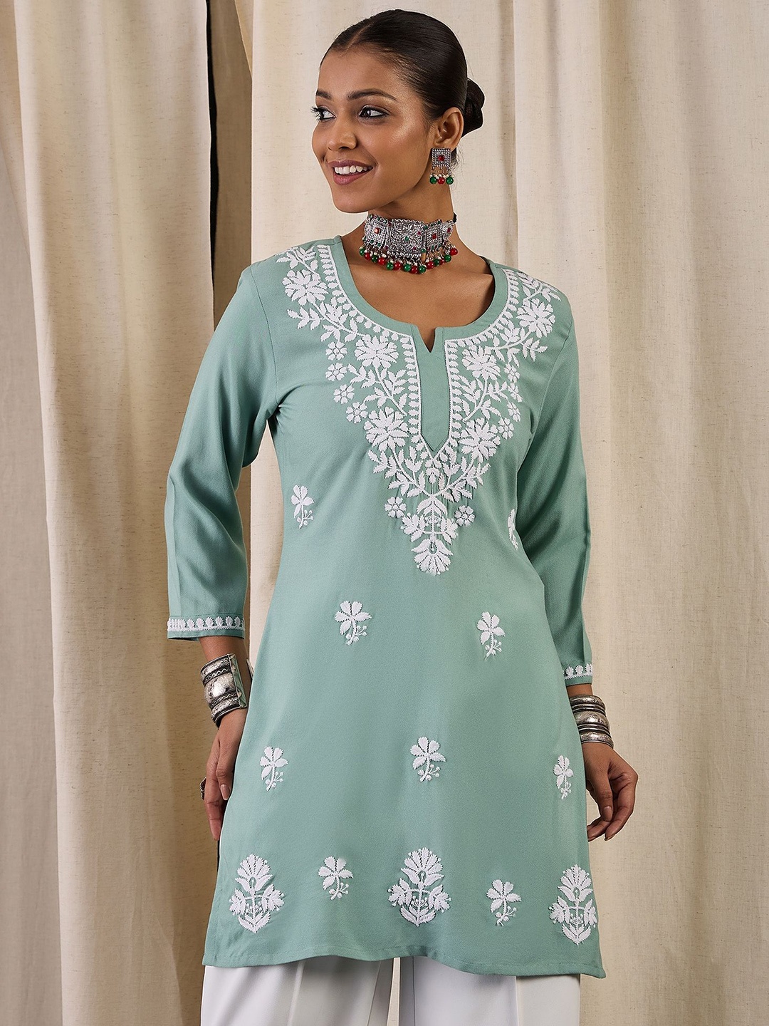 

Anouk Floral Embroidered Thread Work Thread Work Kurti, Teal