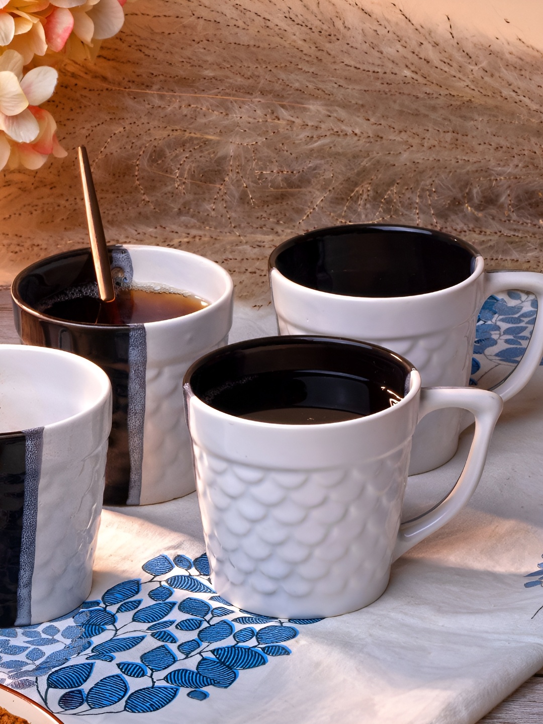 

Storepedia White & Black 4 Piece Textured Ceramic Matte Cups And Mugs