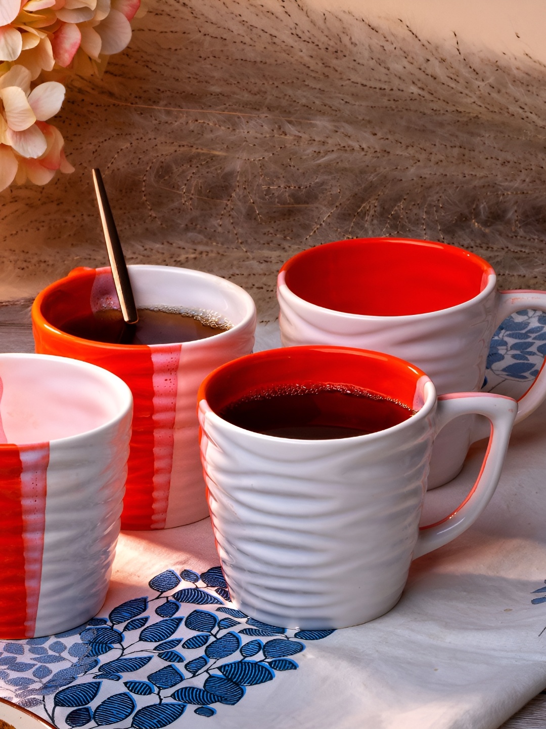 

Storepedia White & Orange 4 Pieces Textured Ceramic Matte Cups 150ml Each