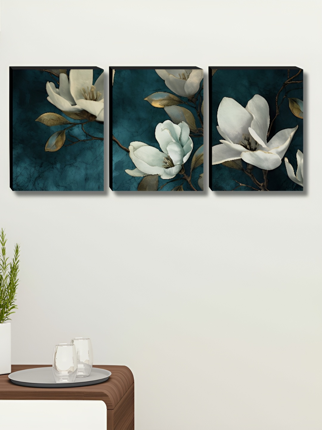 

Myntra Elegant Homes Blue & White 3 Piece Synthetic Wood Floral Wall Paintings