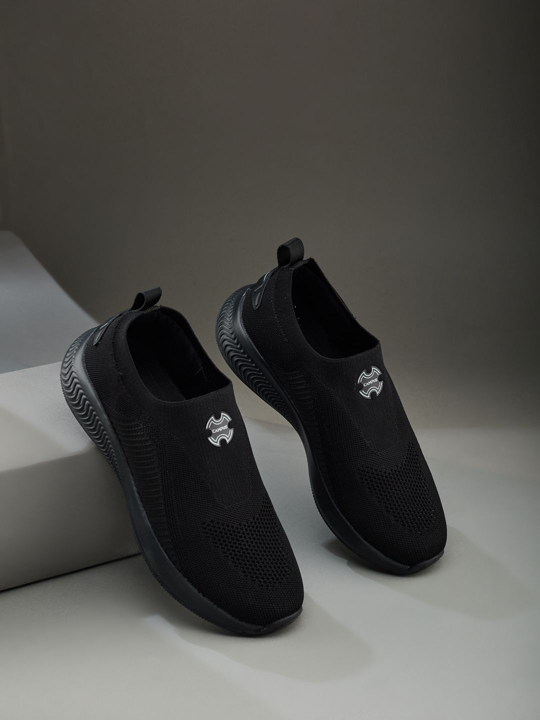 

Campus Women Textured Slip-On Sneakers, Black