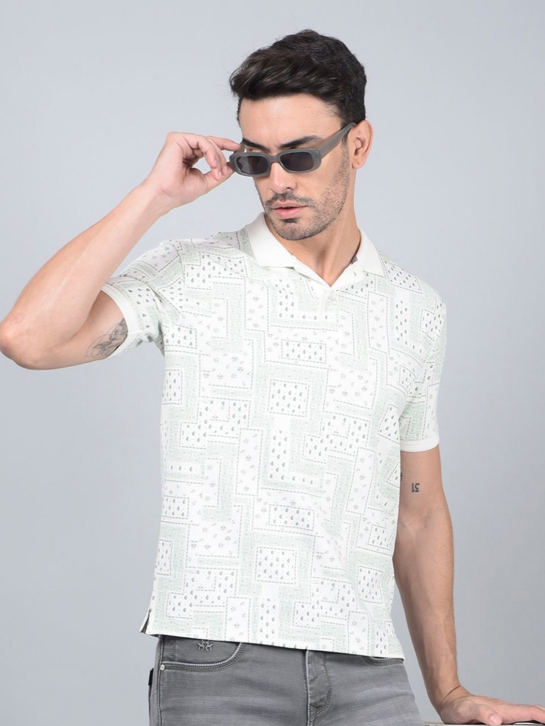 

Crimsoune Club Men Abstract Printed Polo Collar Cotton Slim Fit T-shirt, Blue