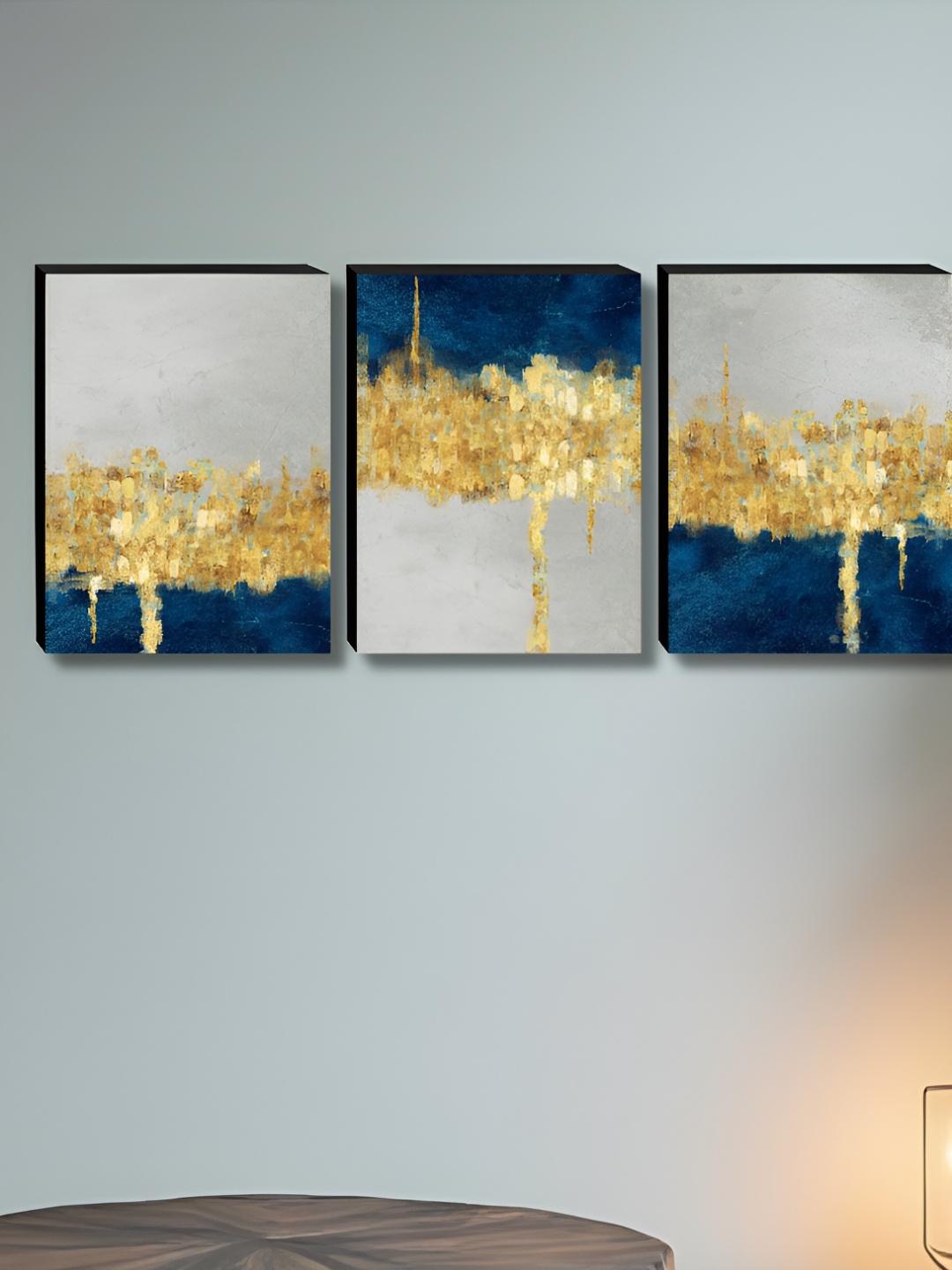 

Myntra Elegant Homes Gold Toned & Blue 3 Pieces Printed Wall Paintings