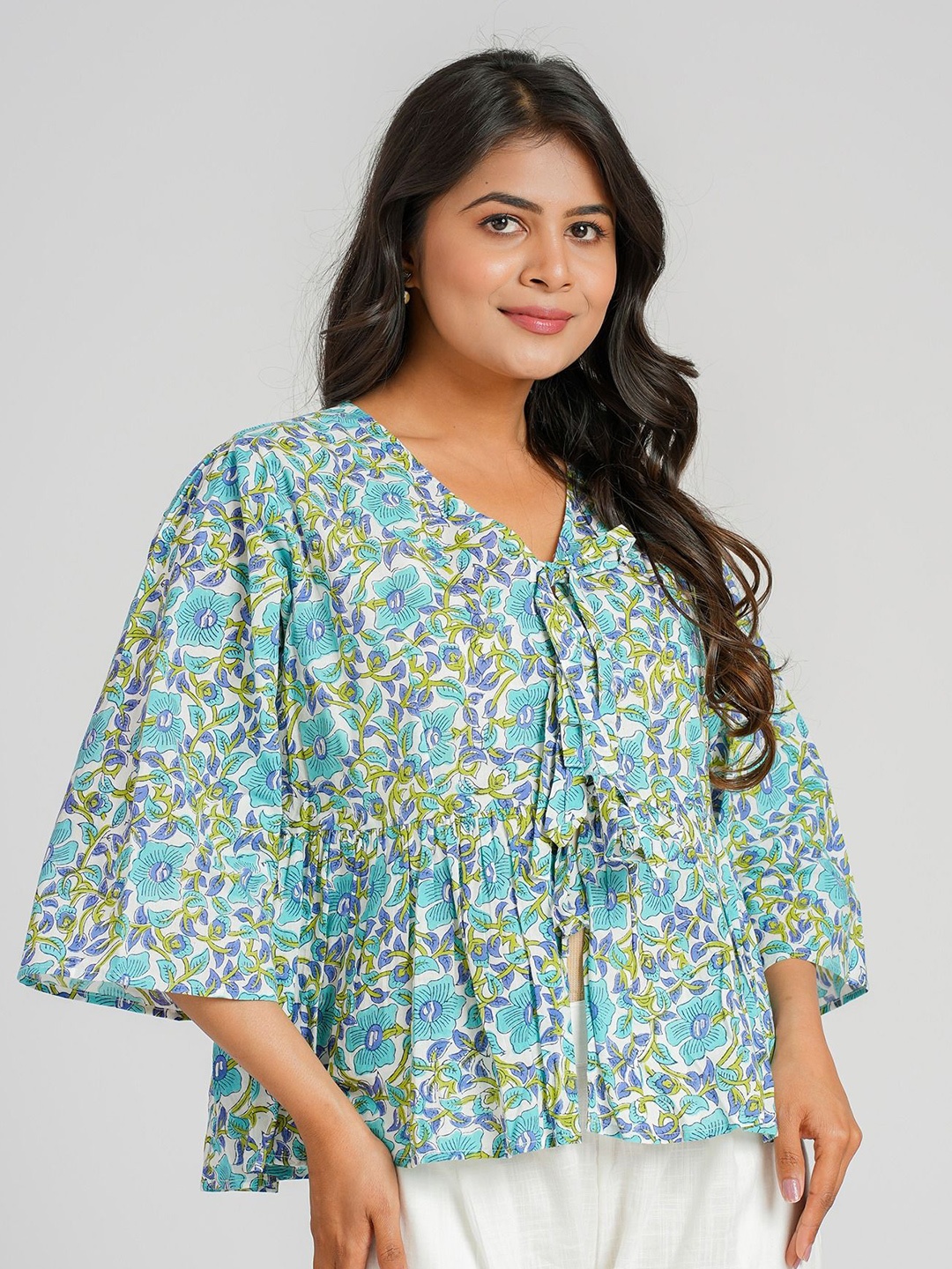 

Cotton Curio Women Floral Printed Tie-Up Neck Flared Sleeves Peplum Top, Blue