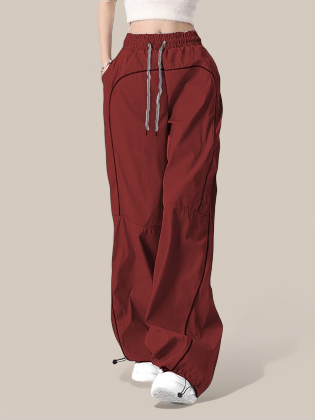 

The Roadster Lifestyle Co Women Loose Fit Mid-Rise Pleated Parachute Trousers, Maroon