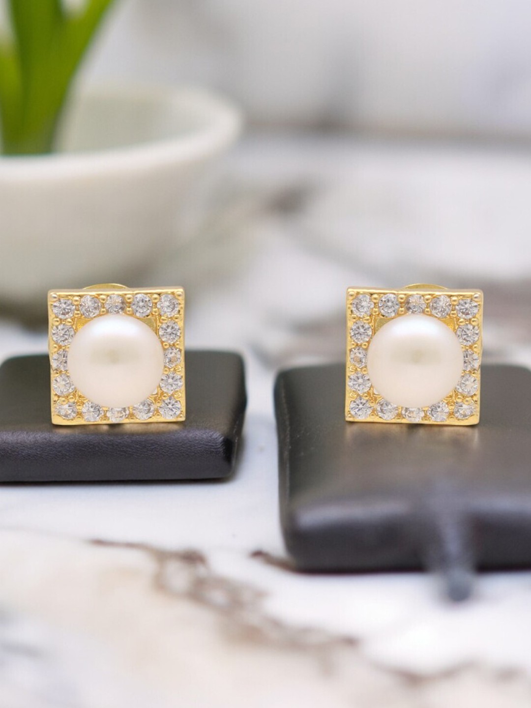 

Sri Jagdamba Pearls Dealer Gold-Plated Cubic Zirconia Studded Contemporary Studs