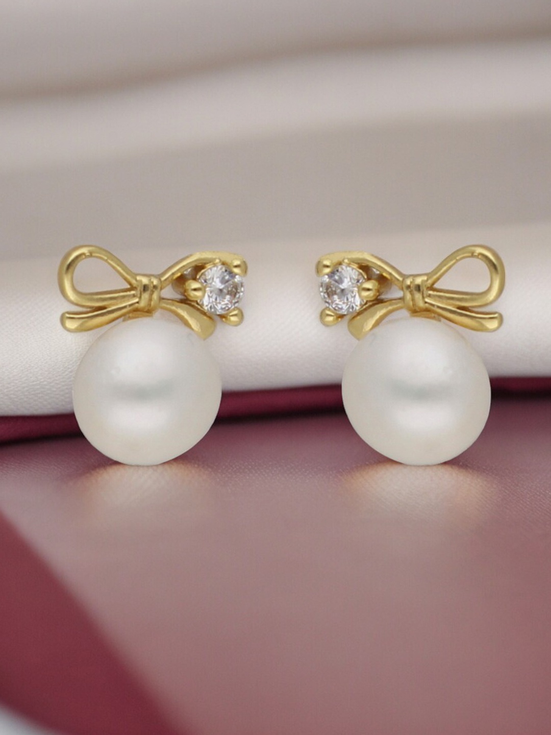 

Sri Jagdamba Pearls Dealer Gold Plated Cubic Zirconia Studded & Pearl Beaded Earrings, White