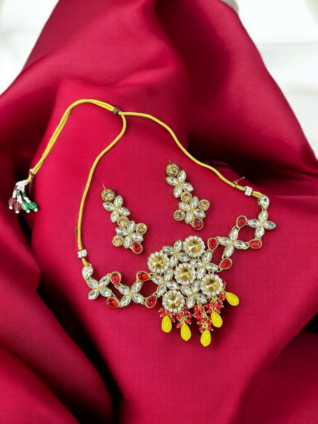 

Saree Swarg Brass-Plated Artificial Stones Studded Jewellery Set, Yellow