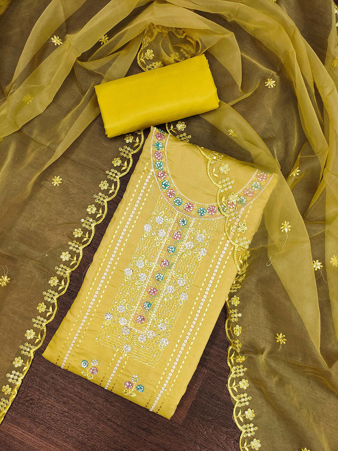 

SHADOW & SAINING Floral Embroidered Roman Silk Sequinned Semi-Stitched Dress Material, Yellow