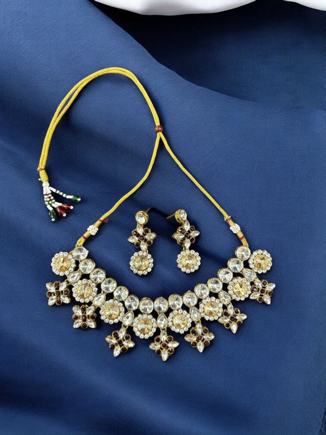 

Saree Swarg Brass-Plated Artificial Stones Studded Jewellery Set, Yellow
