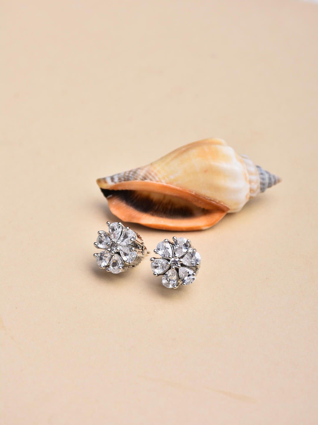 

Reenisaa Rhodium-Plated Artificial Stones Studded Floral Shaped Studs, Silver