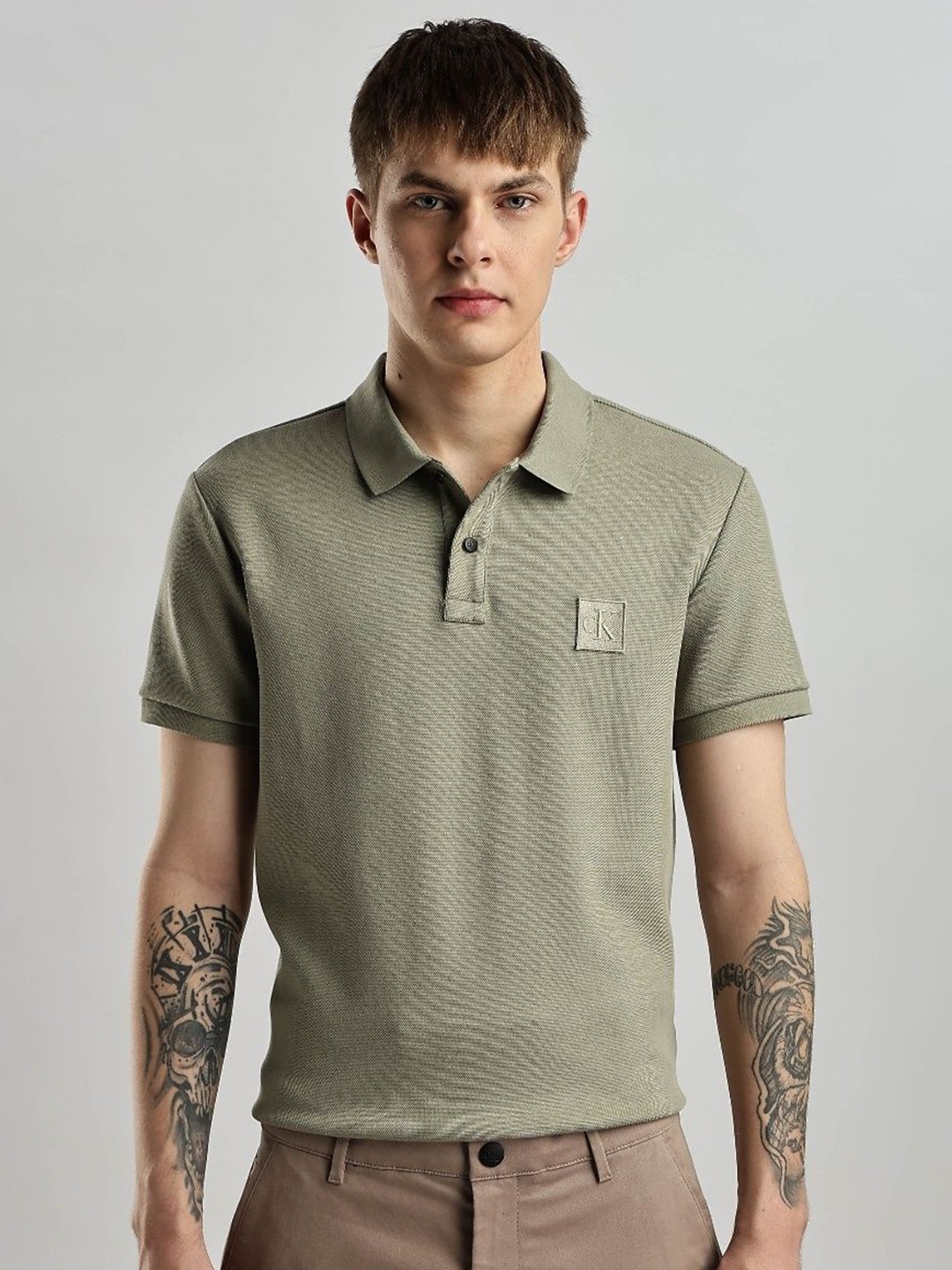 

Calvin Klein Jeans Men Brand Logo Printed Polo Collar T-shirt, Grey