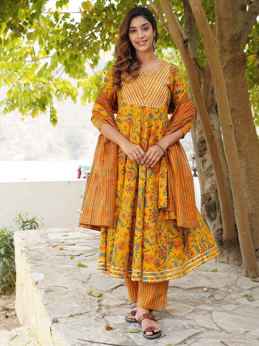 

KALINI Floral Printed Round Neck Pure Cotton Anarkali Kurta With Trousers And Dupatta, Mustard