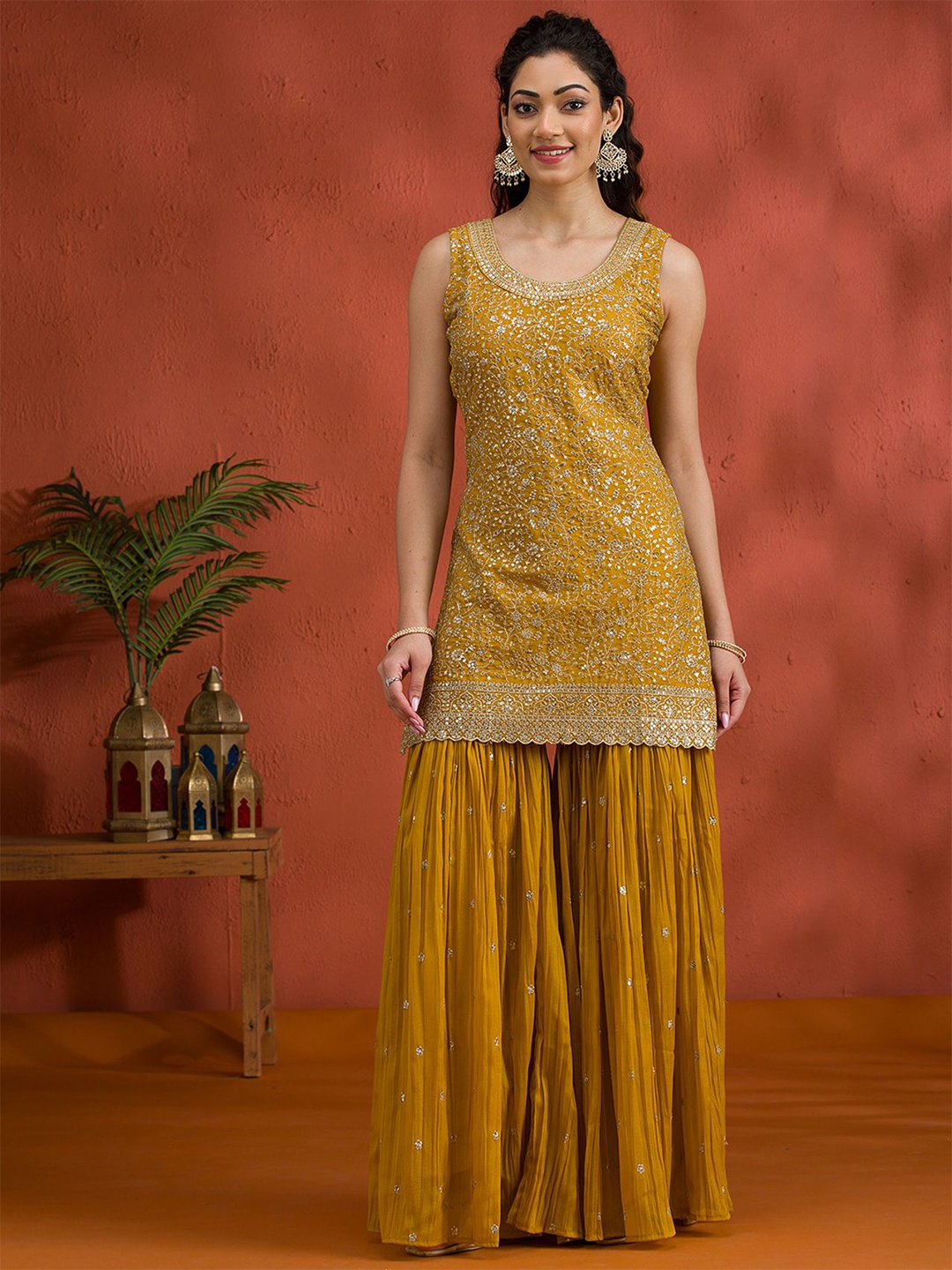 

Koskii Floral Embroidered Round Neck Zari Work Georgette Kurti With Sharara & Dupatta, Mustard