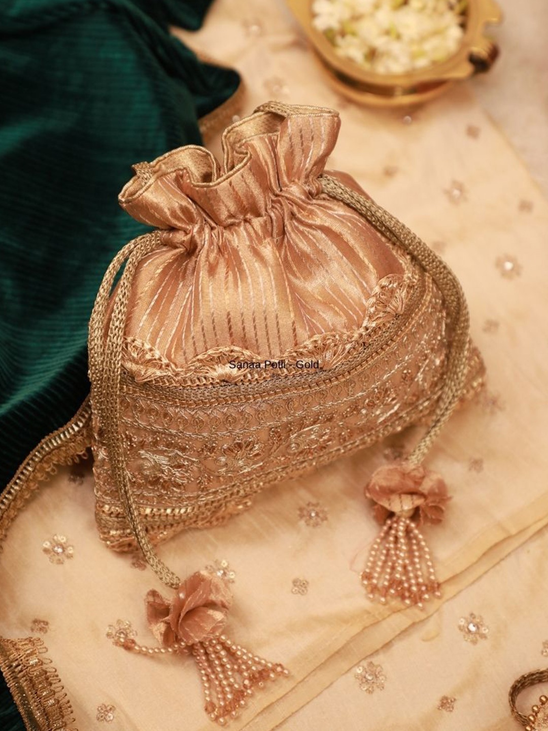 

AMYRA Textured Bucket Shoulder Bag with Tasselled, Gold