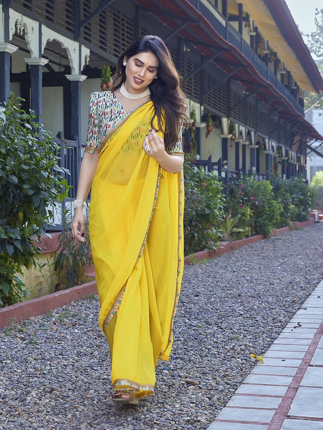 

Nirmohi Fashion Embroidered Pure Georgette Saree, Yellow
