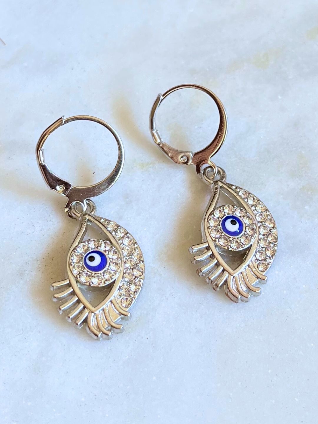 

DressBerry Stainless Steel Artificial Stones Studded Evil Eye Drop Earings, Silver