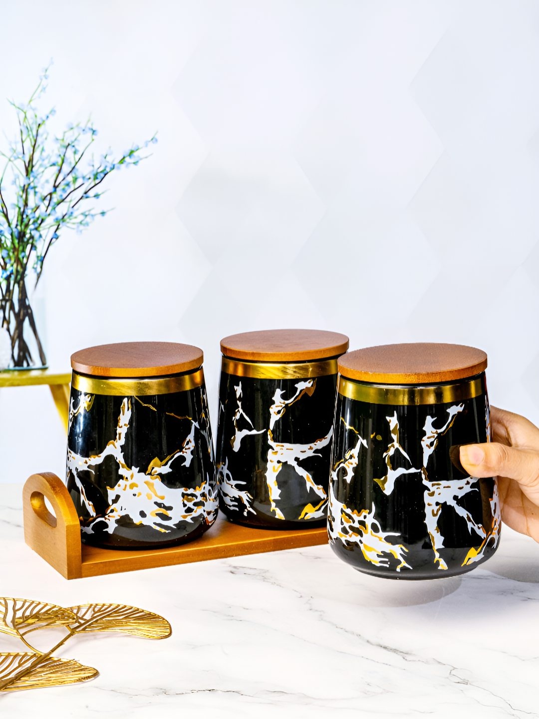 

Roxx Black & Gold Toned 4 Pieces Ceramic Dishwasher Safe Jar set with Wooden Lid & Tray