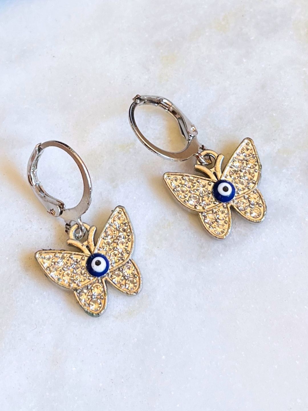 

DressBerry Stainless Steel Artificial Stones Studded Evil Eye Butterfly Hoop Earings, Silver