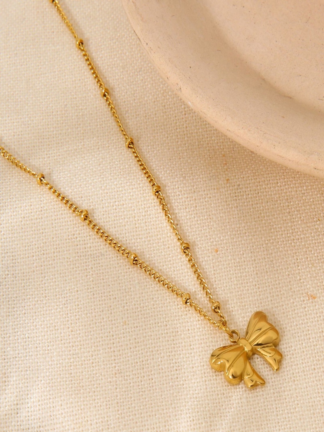 

AQUASTREET Stainless Steel 18K Gold-Plated Bow Shaped Pendant With Chain