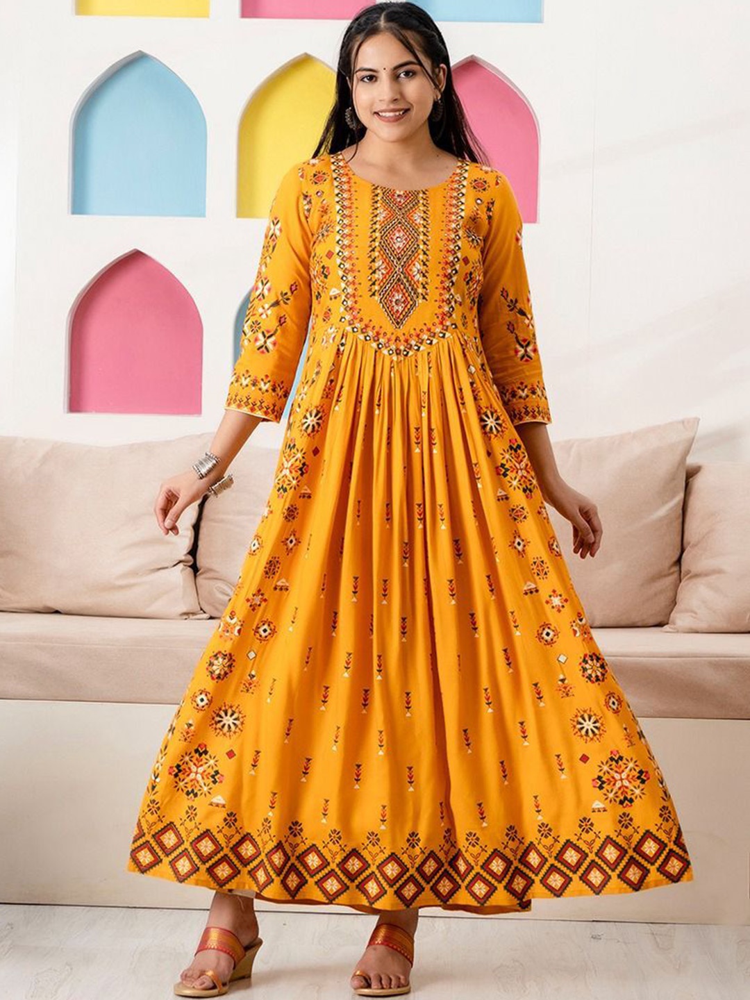 

RAABA Ethnic Motifs Printed Pleated Mirror Work A-Line Kurta, Mustard