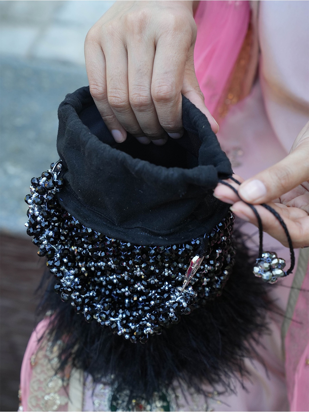 

Chiaro Embellished Potli Clutch With Feather, Black