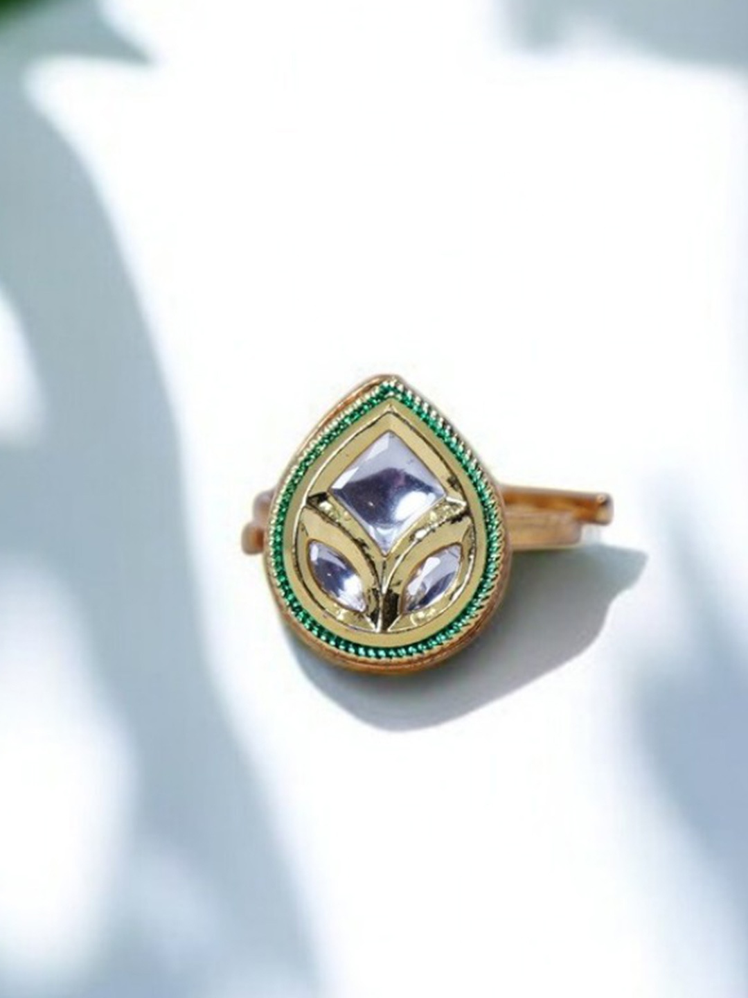 

Chaandi Rivaaz Diyas Gold-Plated Kundan Studded Leaf Shaped Finger Ring