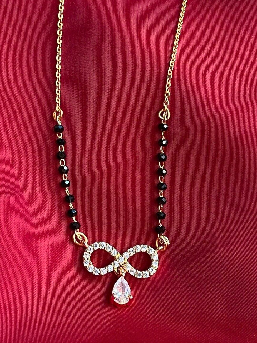 

Anouk Stainless Steel Gold-Plated American Diamond Studded & Artificial Beaded Mangalsutra