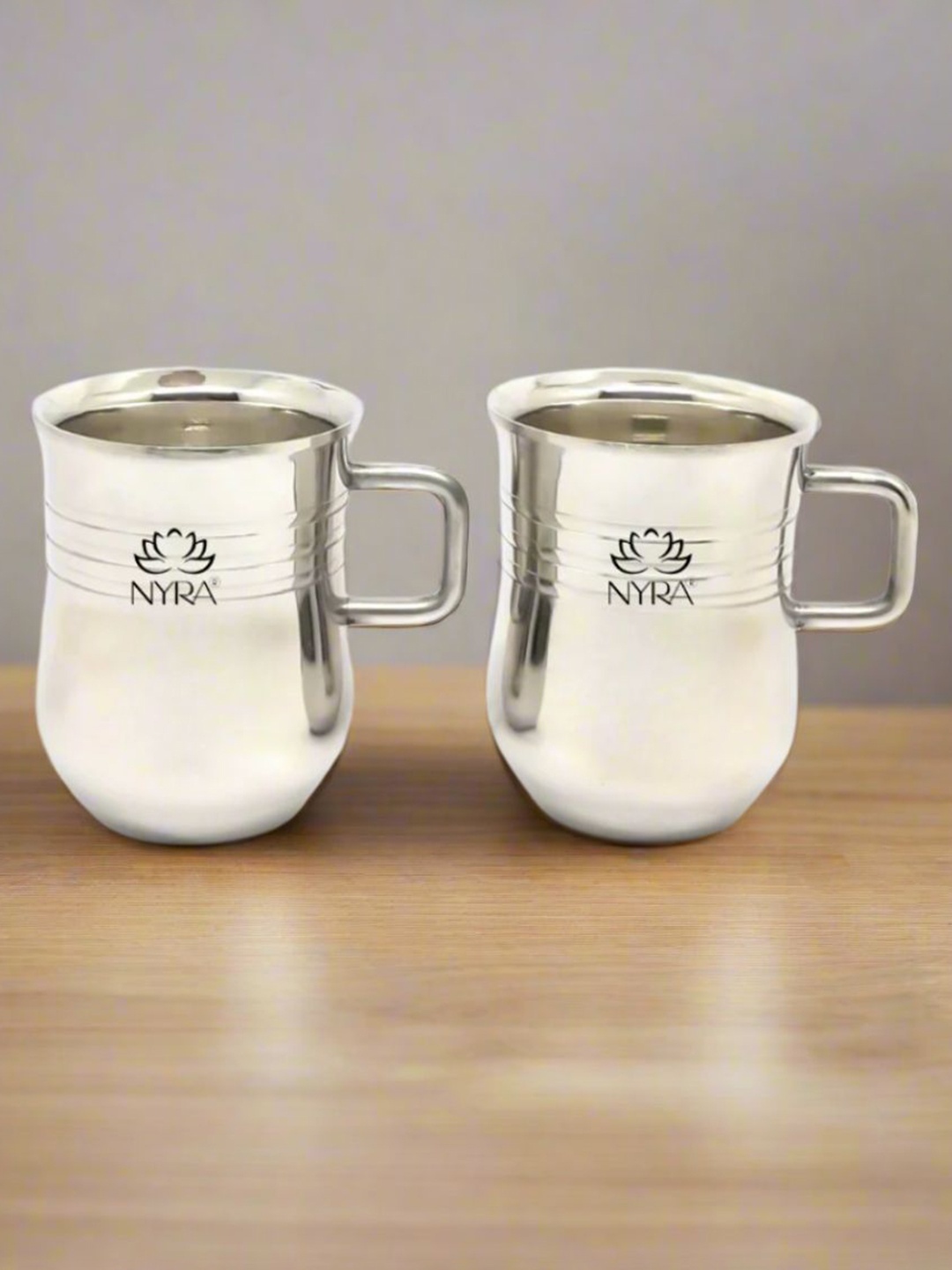 

Nyra Kitchenware Steel & Black 2 Pieces Textured Stainless Steel Glossy Mugs 100ml