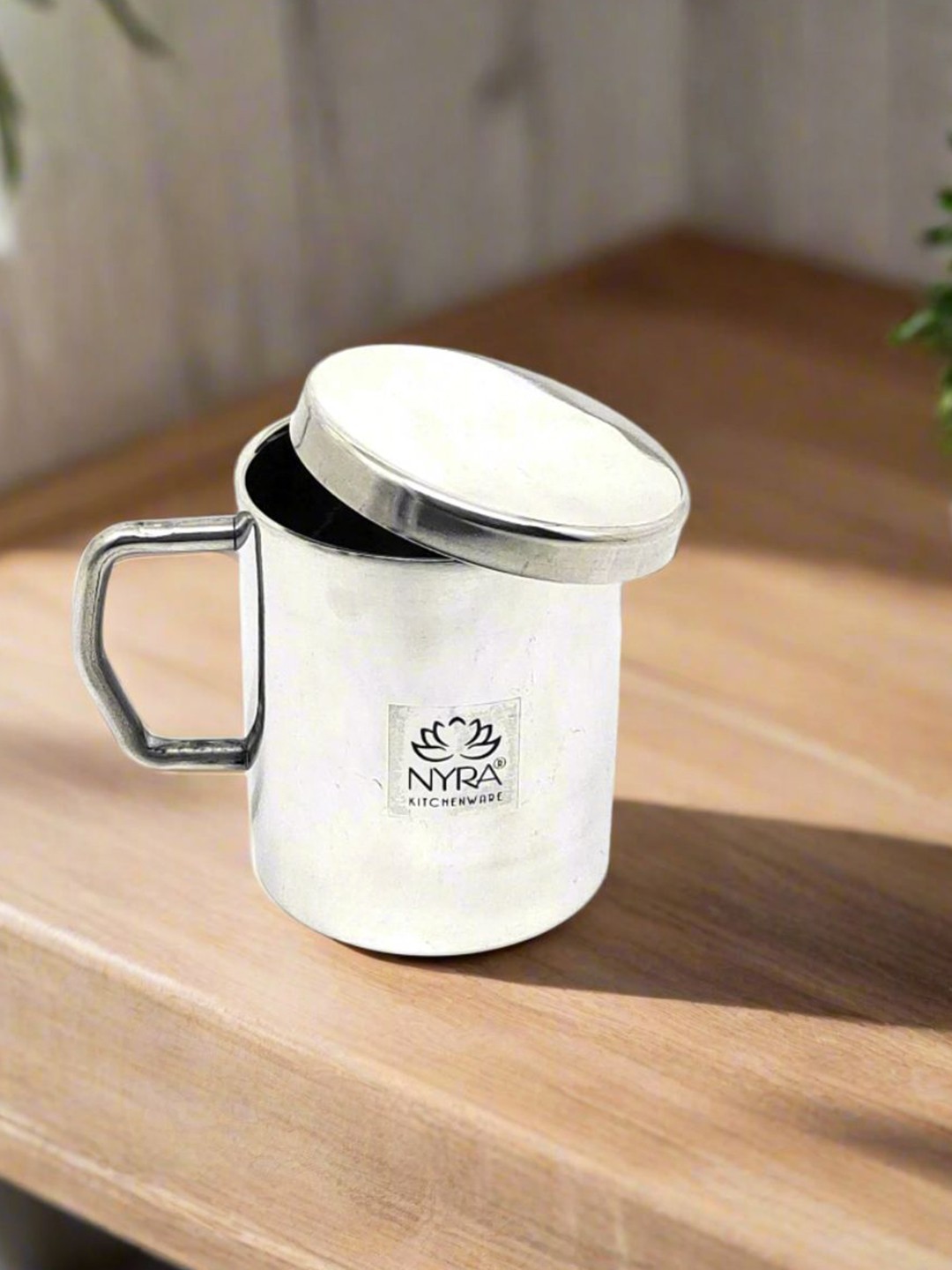 

Nyra Kitchenware Steel & Black Textured Stainless Steel Glossy Cup With Lid-300 ml