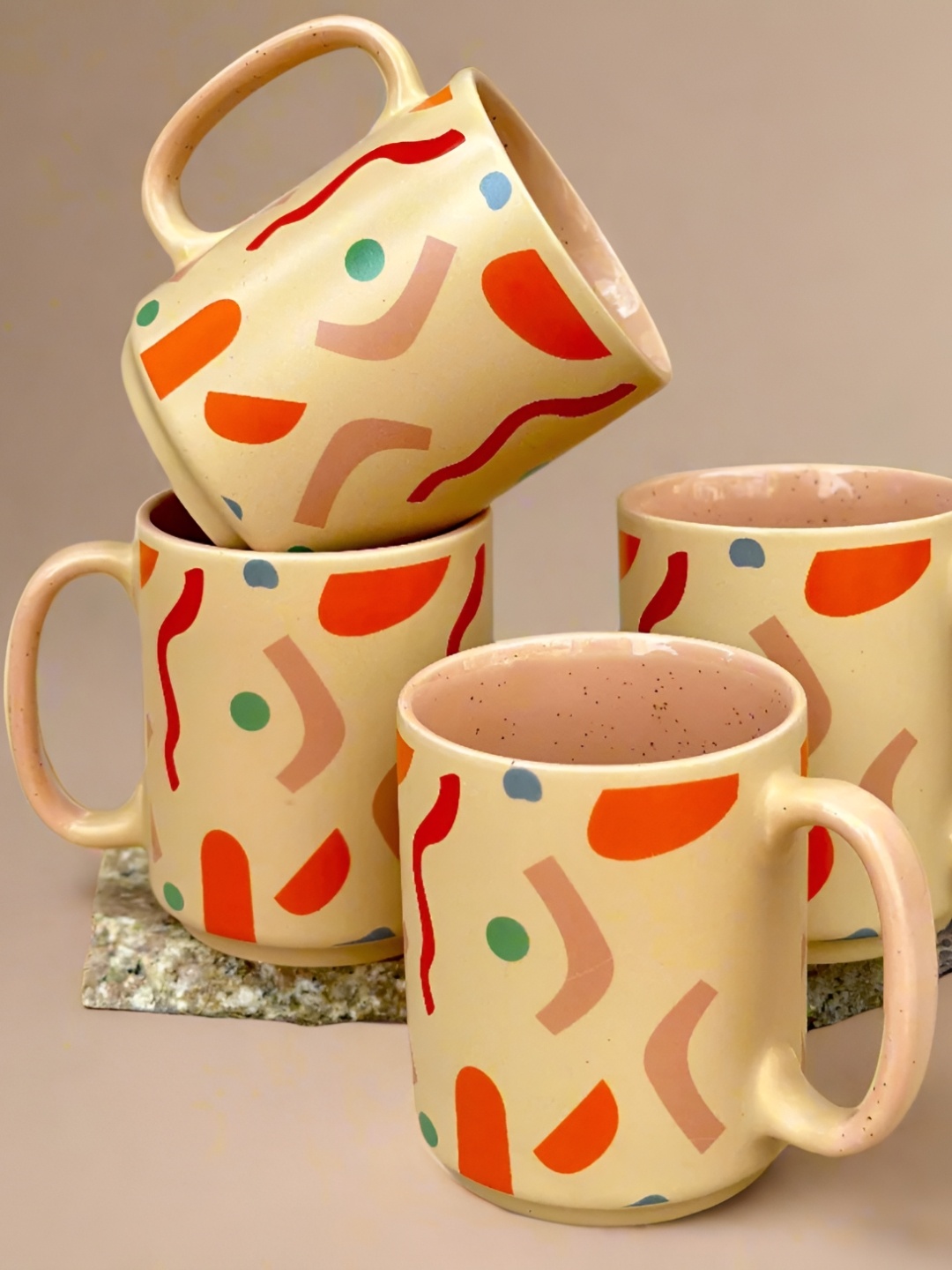 

NURTURE INDIA Beige & Red 4 Pieces Printed Ceramic Glossy Mugs 400ml