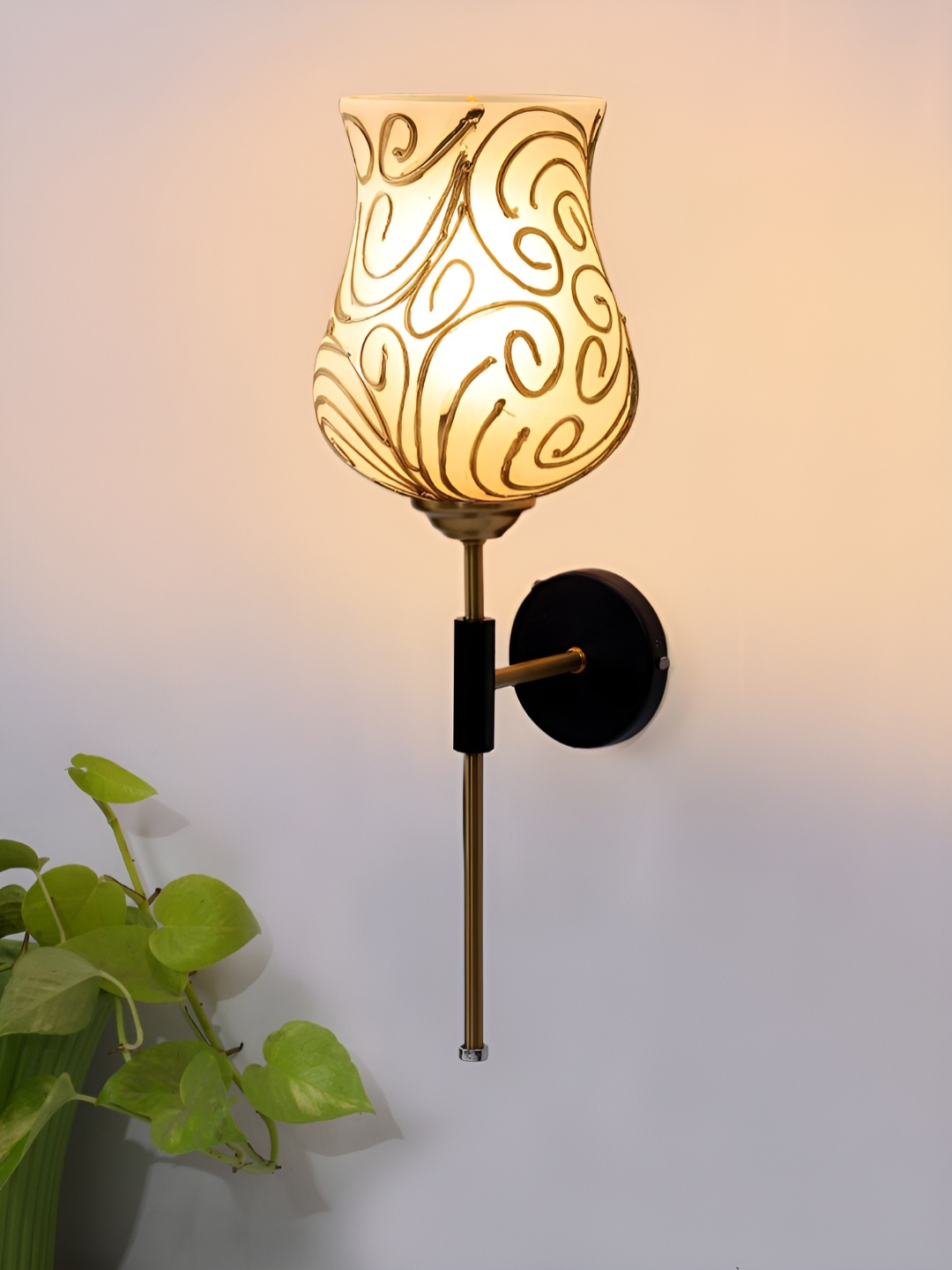 

Devansh White & Gold-Toned Metal Traditional Abstract Shaped Shaped Wall Lamp