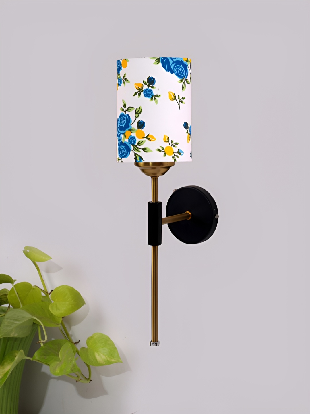 

Devansh White & Blue Printed Metal Traditional Abstract Shaped Shaped Wall Lamp