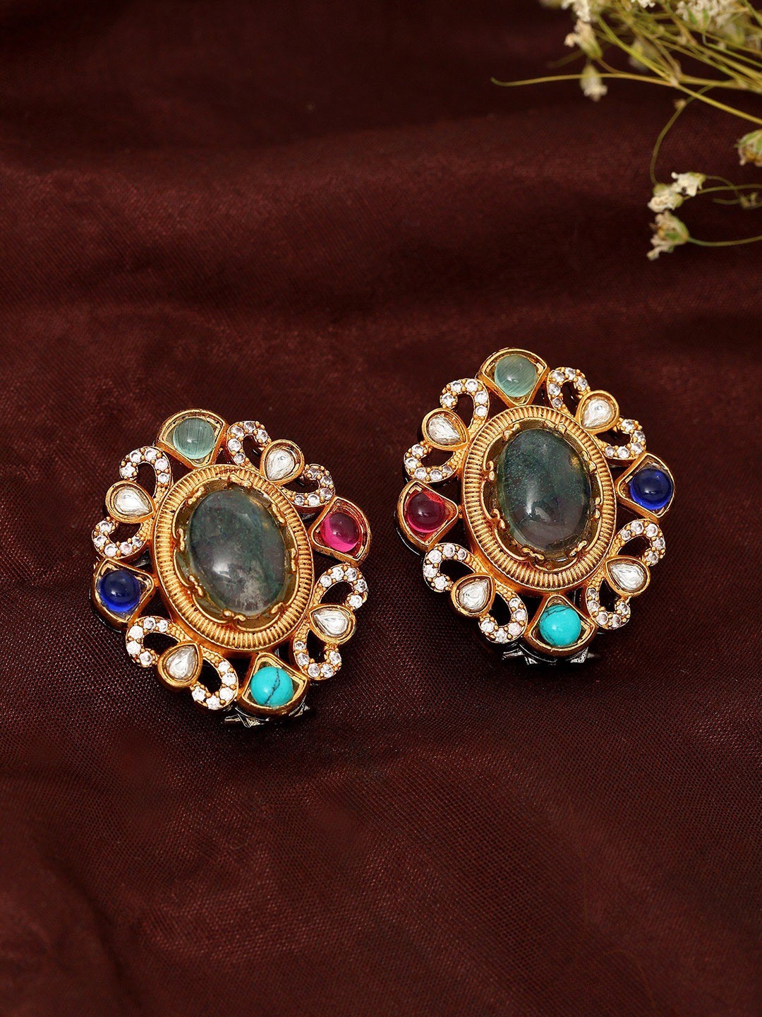 

Exotic India Gold-Plated Artificial Stone Studded Oval Studs Earrings