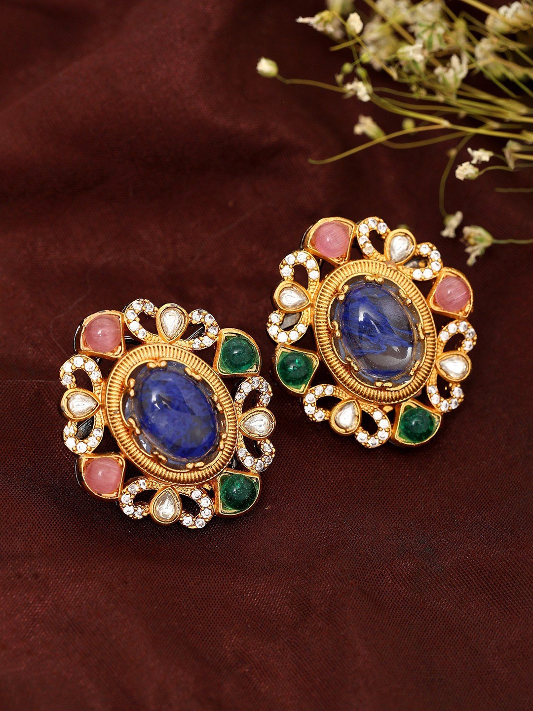 

Exotic India Gold Plated Oval Studs Earrings