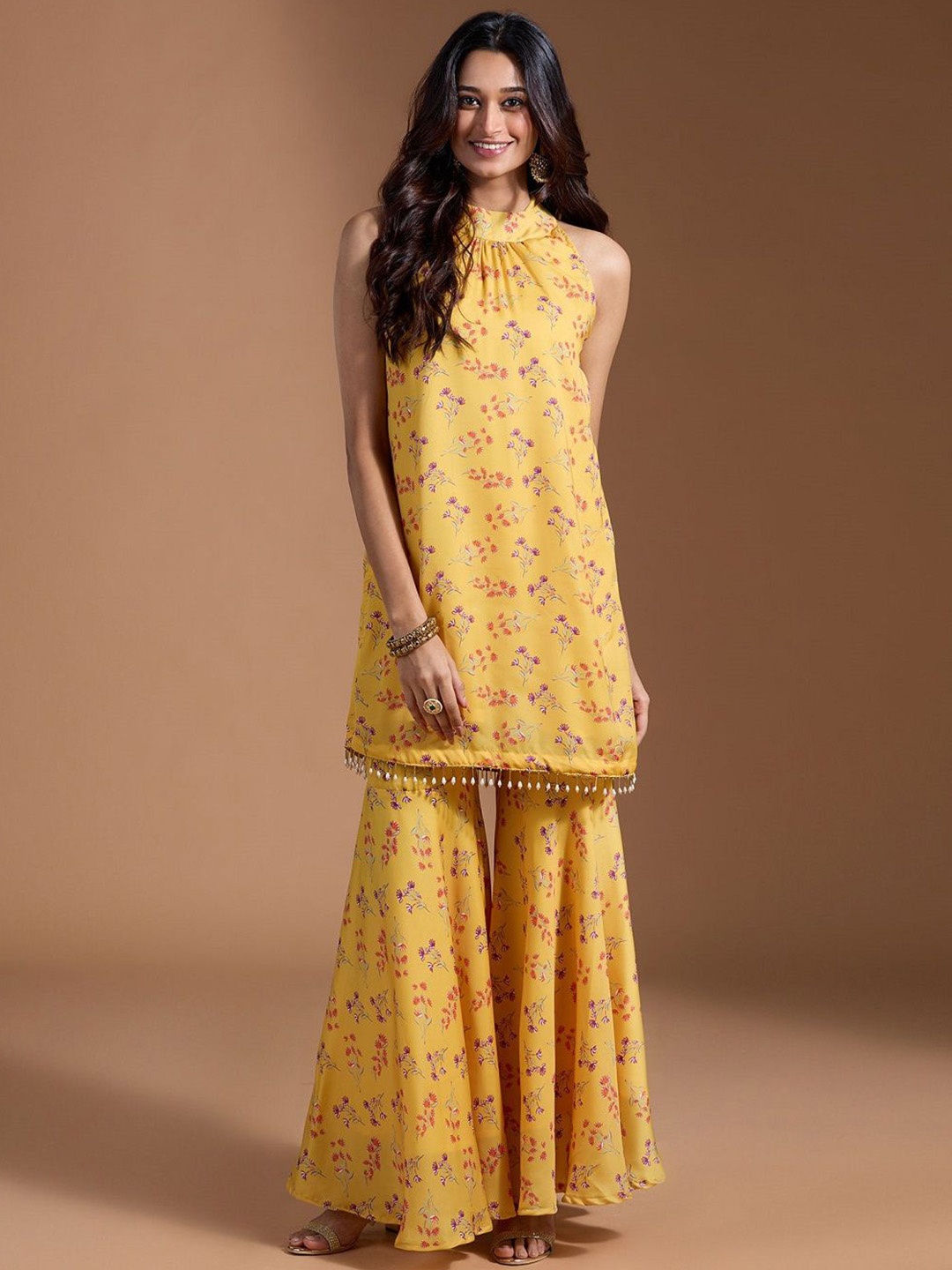 

Moda Rapido Floral Printed Sleeveless Halter Neck Armani Satin Straight Kurta With Sharara, Yellow