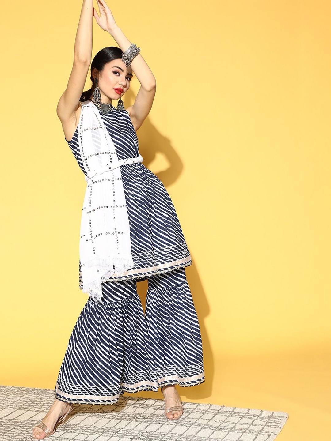 

DIVASTRI Women Leheriya Printed Regular Mirror Work Kurta with Sharara & With Dupatta, Navy blue