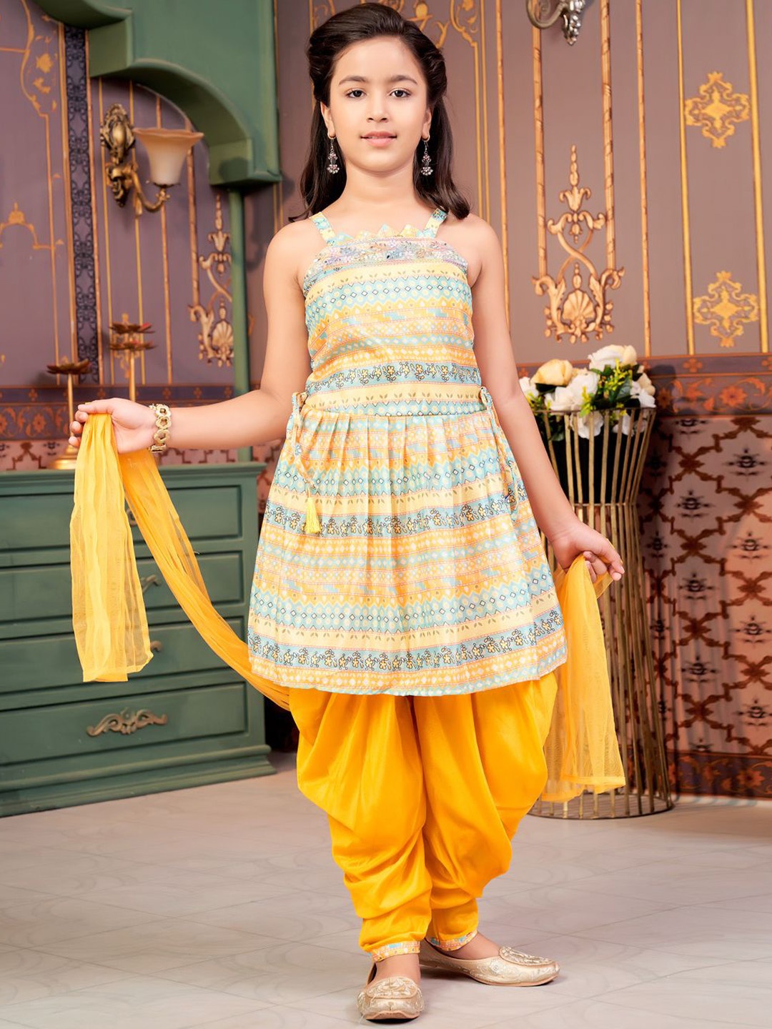 

BAESD Girls Geometric Printed Shoulder Straps Silk A-Line Kurta With Dhoti Pants & Dupatta, Yellow